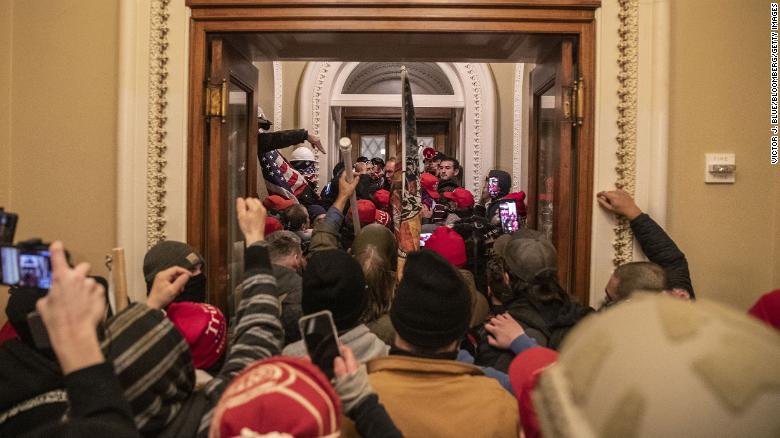 Agitators inside the Capitol after breaking through barricades on January 6, 2021.