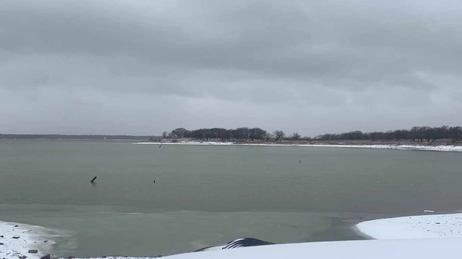 scene with air mattress floating on lake