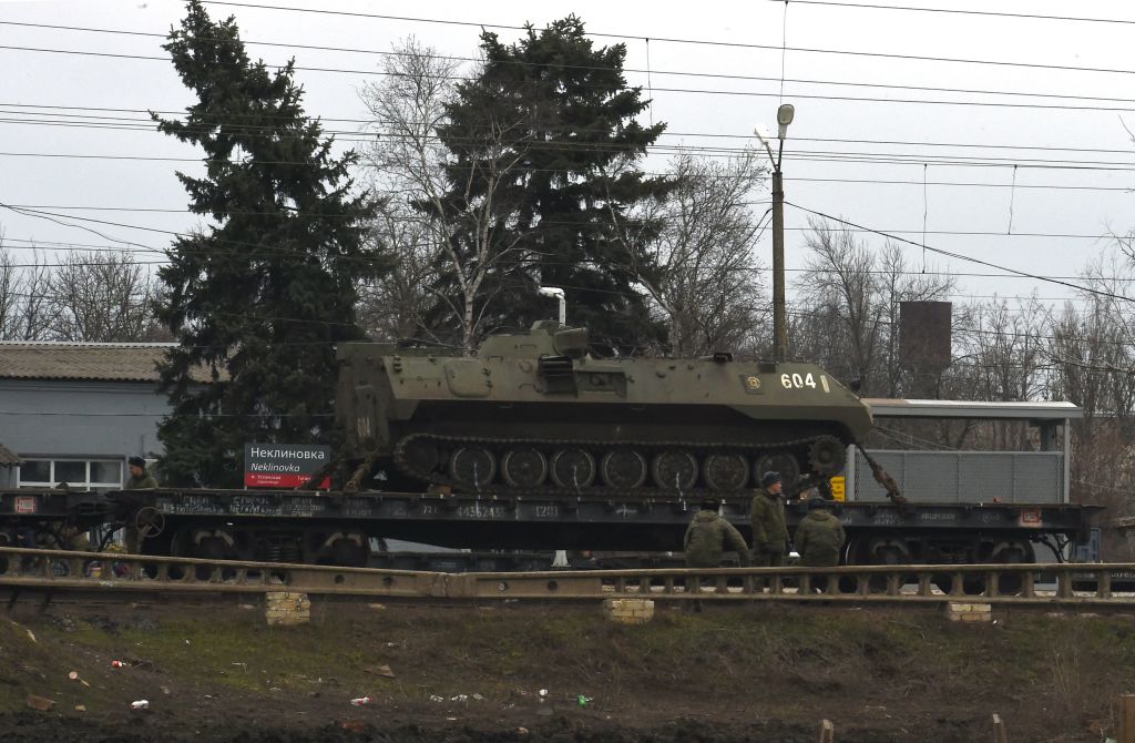 A Russian military vehicle is seen loaded on a train platform at the Neklinovka railway station in Russia's southern Rostov region, which borders the self-proclaimed Donetsk People's Republic, on February 23, 2022. (Photo by STRINGER / AFP) (Photo by STRINGER/AFP via Getty Images)