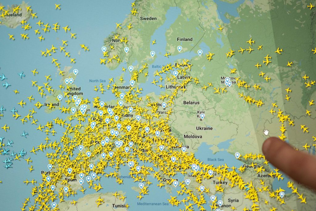A photo shows a page from the Flightradar 24 website which shows civilian flights in Europe, February 24, 2022 in Nantes, western France.  - The Russian president announced a military operation in Ukraine on February 24, 2022, with explosions heard soon after across the country and his foreign minister warning a 