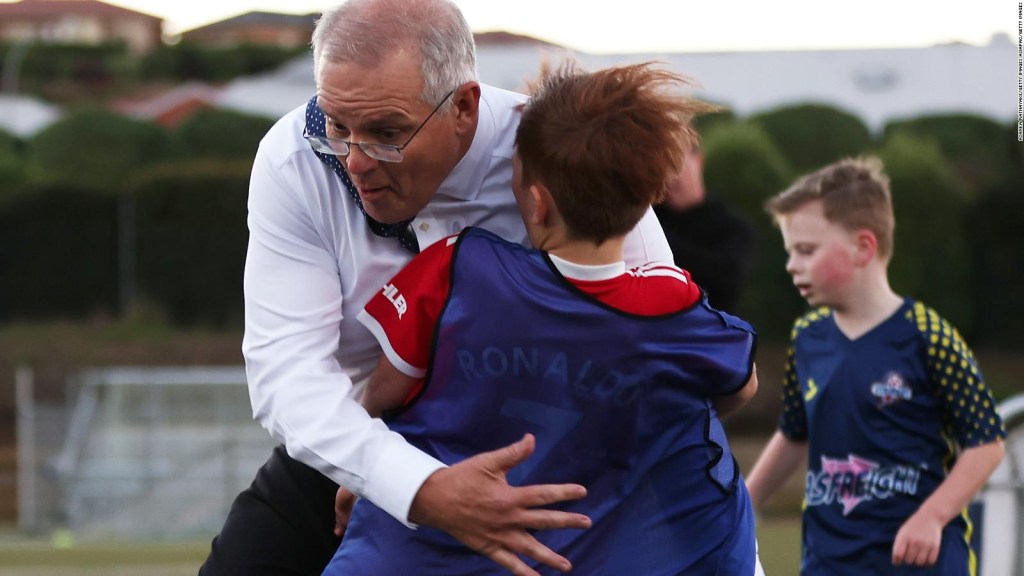Australian Prime Minister "tackle" a child in a game