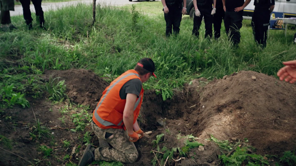 Searching for the bodies of Ukrainian civilians buried by the Russians