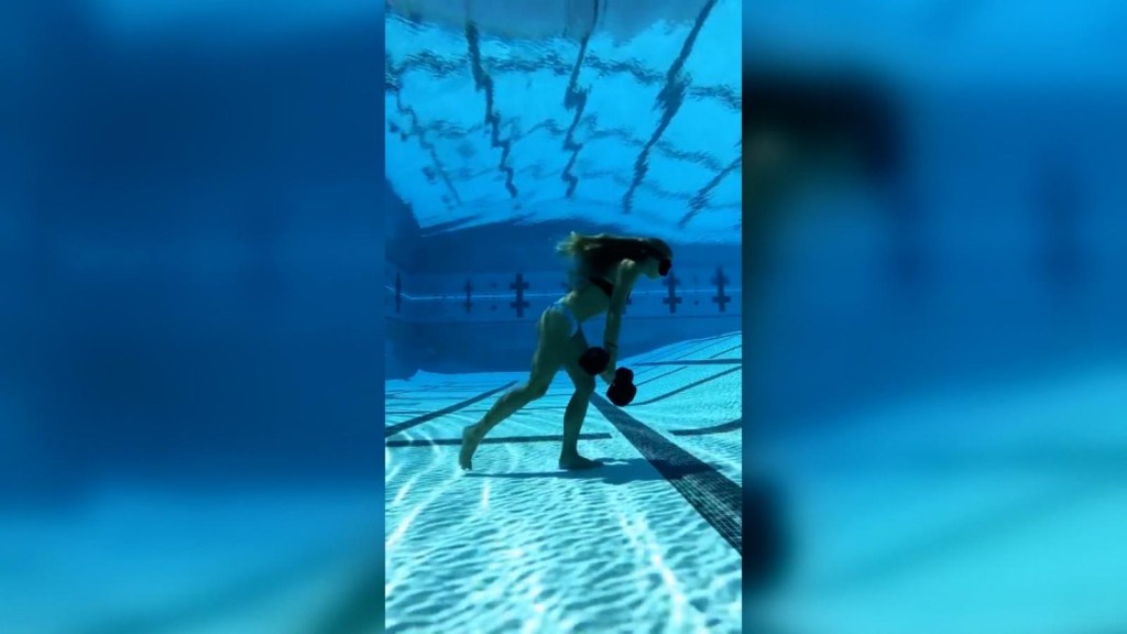 Walk in a 50-meter pool with weights and without breathing