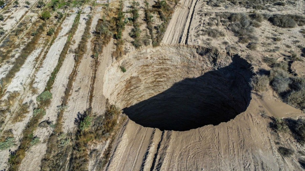 What is a sinkhole and why does a giant cause a stir in Chile?