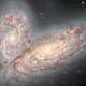 Telescopio capta dos galaxias espirales en proceso de fusión