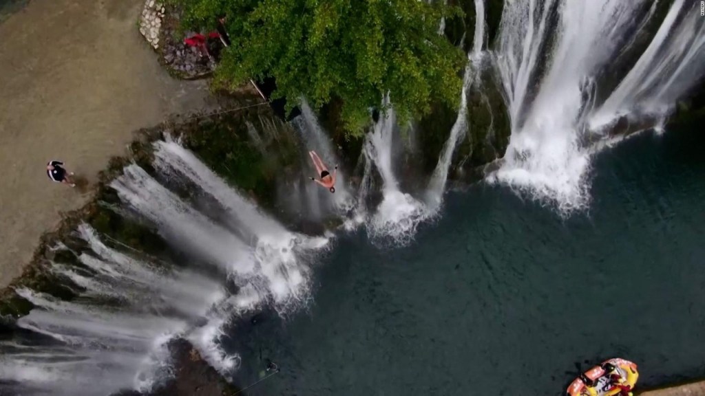 Divers defied gravity with their jumps from a waterfall
