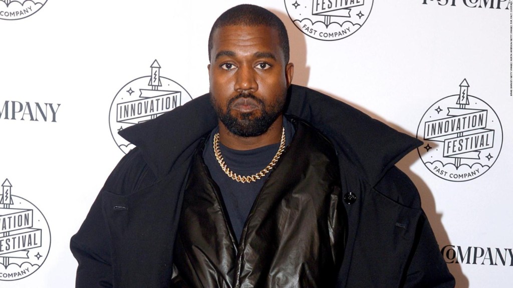 Kanye West displays his Yeezy Gap clothing line in giant garbage bags