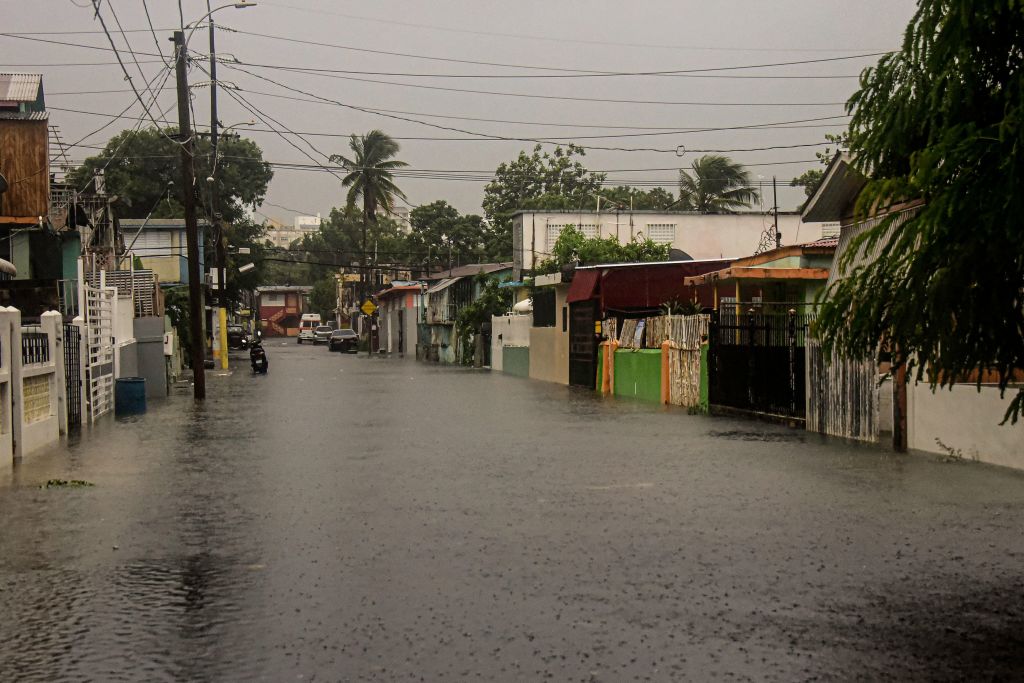 A flooded road is seen during the passage of hurricane Fiona in Villa Blanca, Puerto Rico, on September 18, 2022. - Fiona touched Puerto Rico at 3:20 p.m. local time (7:20 GMT), according to information from the United States National Hurricane Center (NHC), leaving a general blackout and rivers overflowing. (Photo by Jose Rodriguez / AFP) (Photo by JOSE RODRIGUEZ/AFP via Getty Images)
