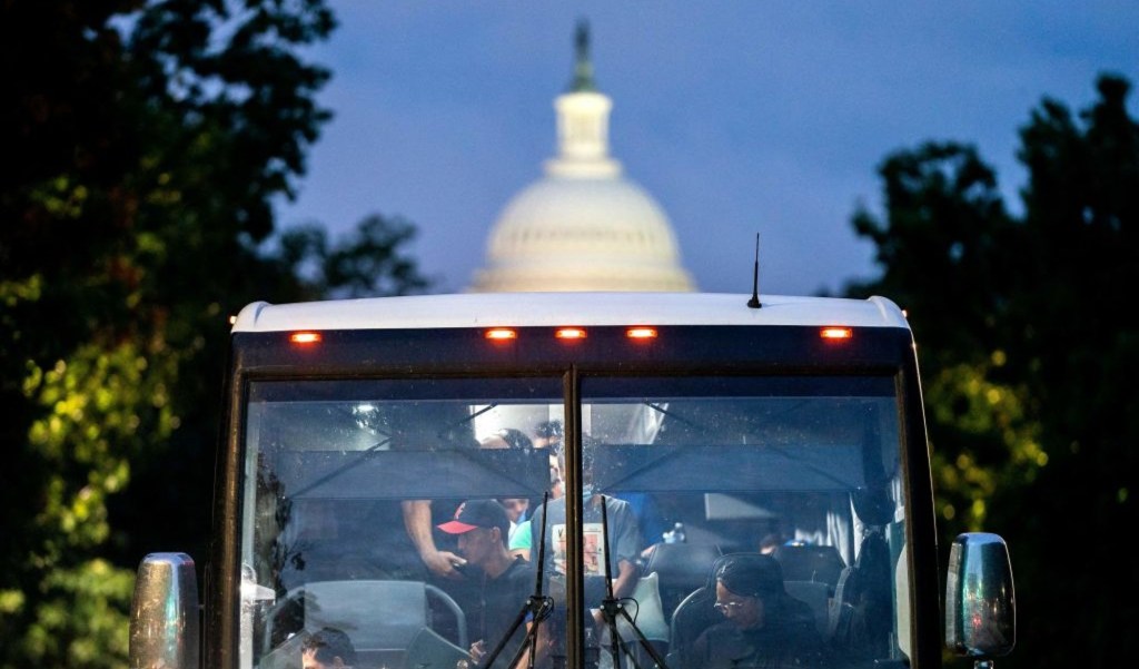 Immigrants from Texas on a bus near the Capitol in Washington on August 11, 2022. (Credit: Stefani Reynolds / AFP / Getty Images)