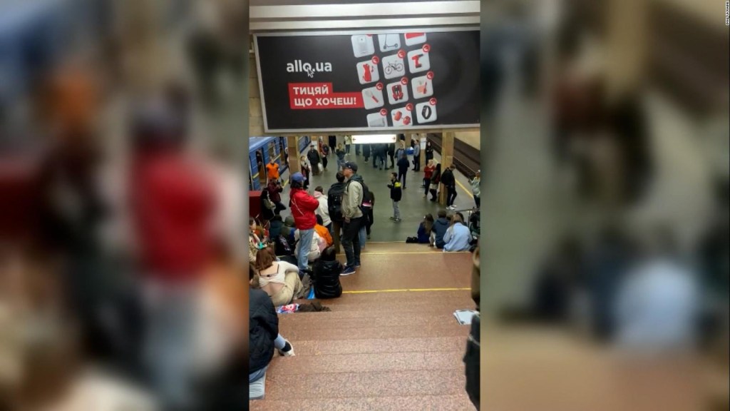 Refugee citizens at a Kyiv metro station sing their national anthem