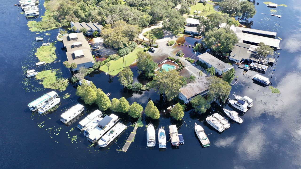 hundreds of homes in Florida are still underwater and a river would continue to flood by Thanksgiving