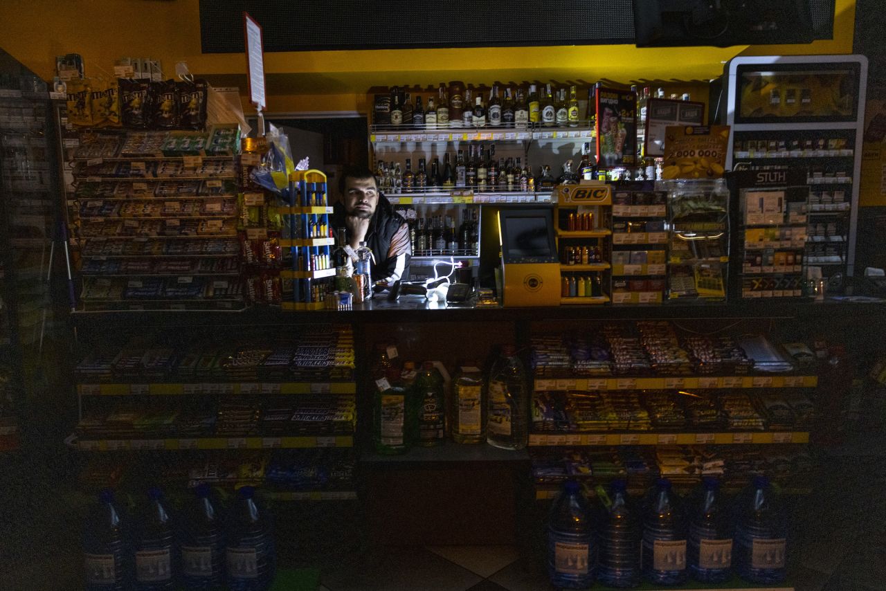 An employee at a gas station in Kiev during a power outage on Friday. 