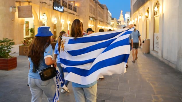Uruguayan fans walk the streets with flags and scarves ahead of the FIFA World Cup Qatar 2022 at Souq Waqif on November 17, 2022 in Doha, Qatar.  (Photo: Dan Mullan/Getty Images)