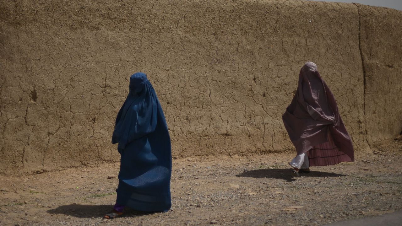 Afghan women walk along a road in Kandahar on July 29, 2022. (Photo: Daniel Leal/AFP/Getty Images)