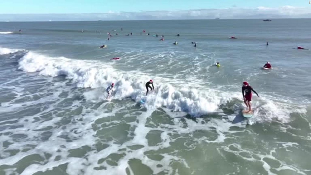 look at these "Santa Claus" surfing on the beaches of Florida