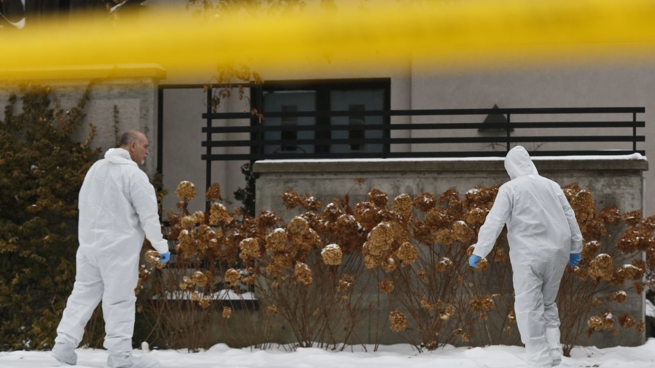 Forensic investigators collect evidence outside the home of Barry and Honey Sherman, where their bodies were found in December 2017.