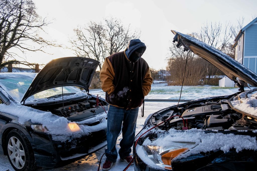 Antonio Smothers gets out of his vehicle on December 23, 2022 after the winter storm moved through the Middle Tennessee region bringing freezing rain, snow and freezing temperatures, in Nashville, Tennessee on December 23, 2022. - (Photo by SETH HERALD/AFP via Fake Images)
