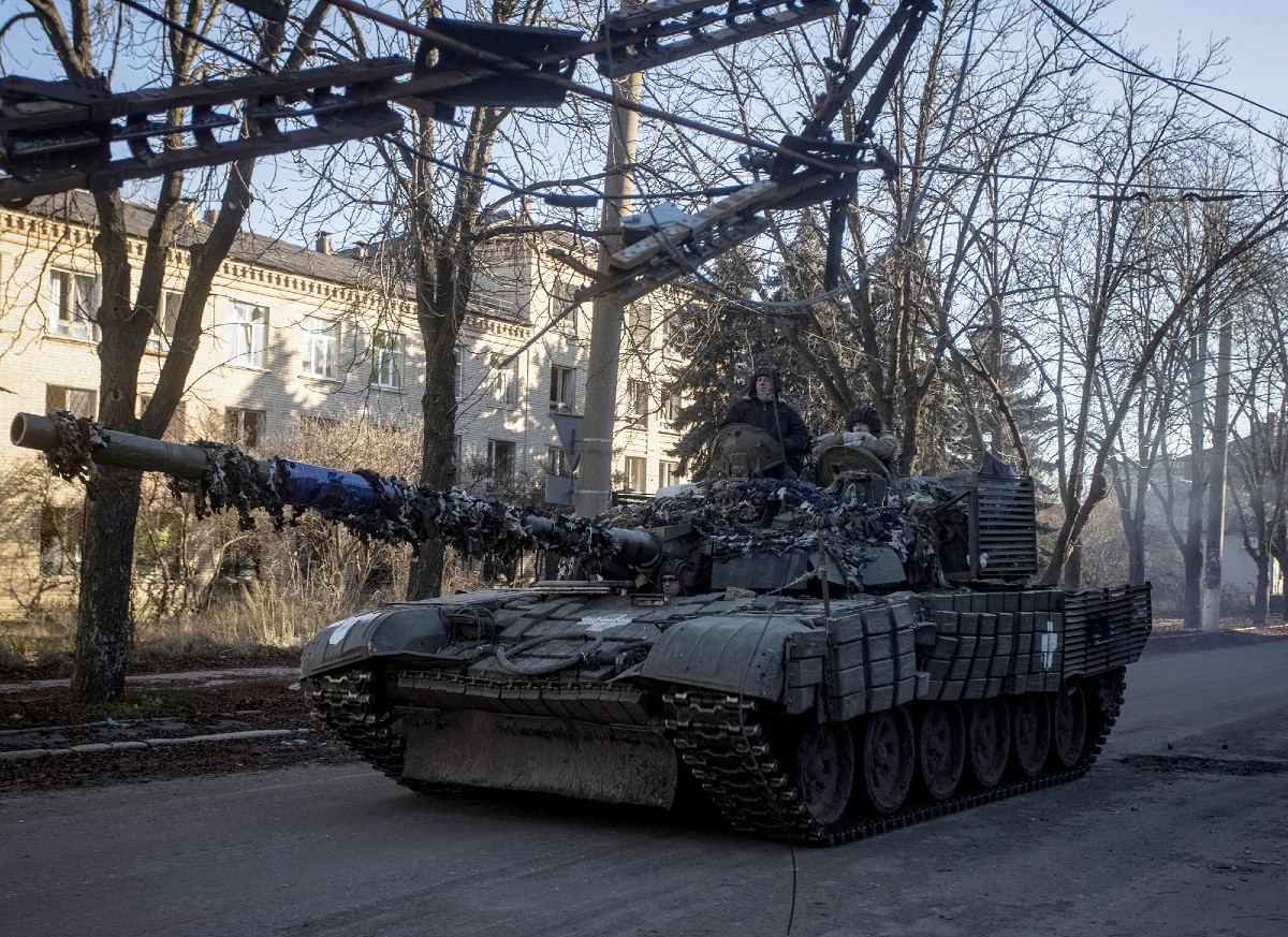 Ukrainian servicemen ride atop a tank in Bakhmut, in the Donetsk region, Ukraine, on December 5. (Yevhen Titov/Reuters) 