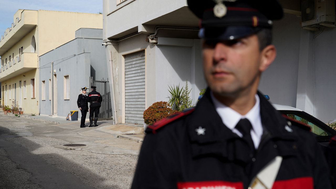 Police stand guard near Matteo Messina Denaro's hideout in the Sicilian town of Campobello di Mazara, on January 17, 2023, one day after his arrest.