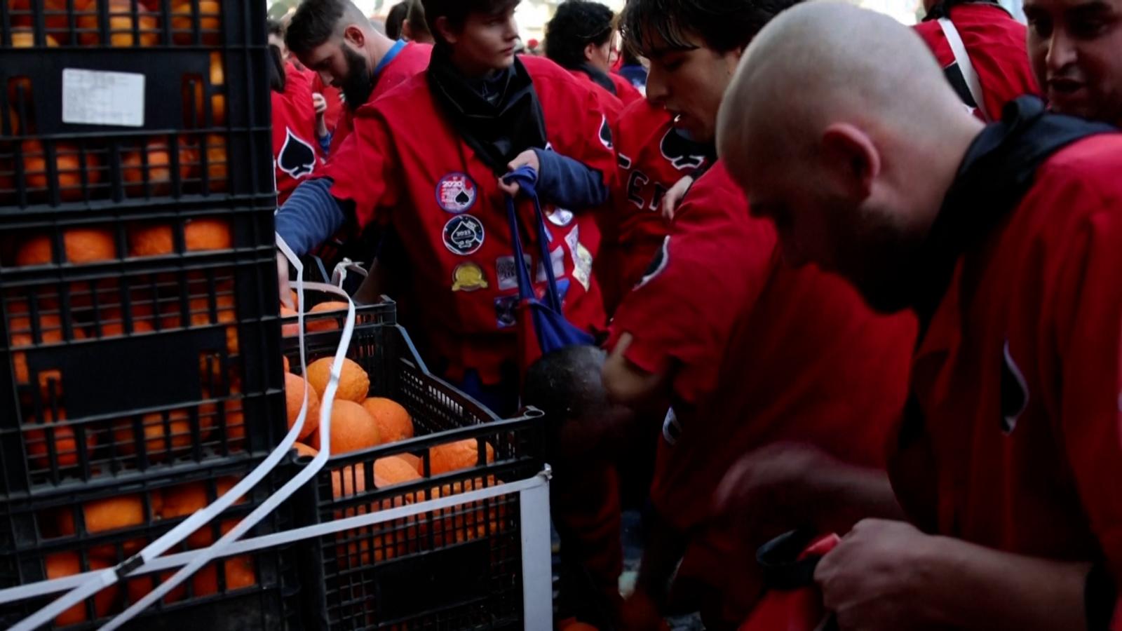 Watch as thousands of oranges fly through the air in this unusual