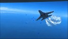Sebuah video baru menunjukkan insiden antara drone Amerika dan pesawat tempur Rusia