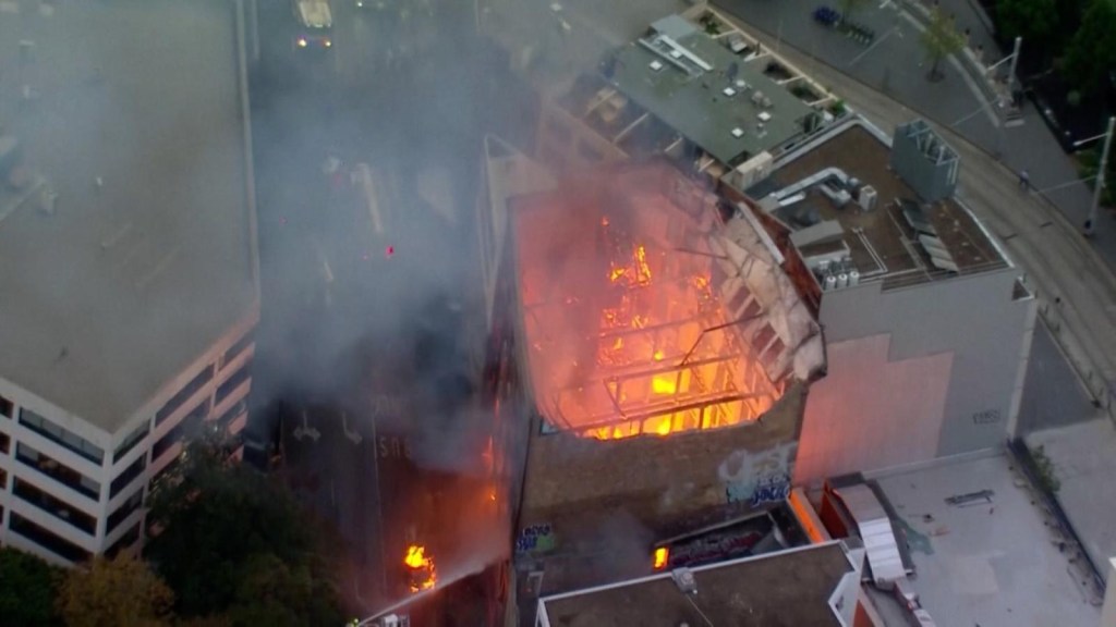 Fire in Sydney: watch a building collapse in flames