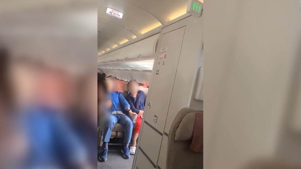 Man arrested for opening plane door in flight
