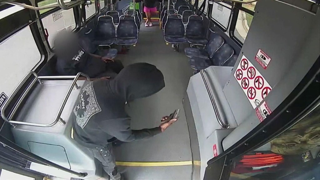 Driver and passenger face gunfire on a bus
