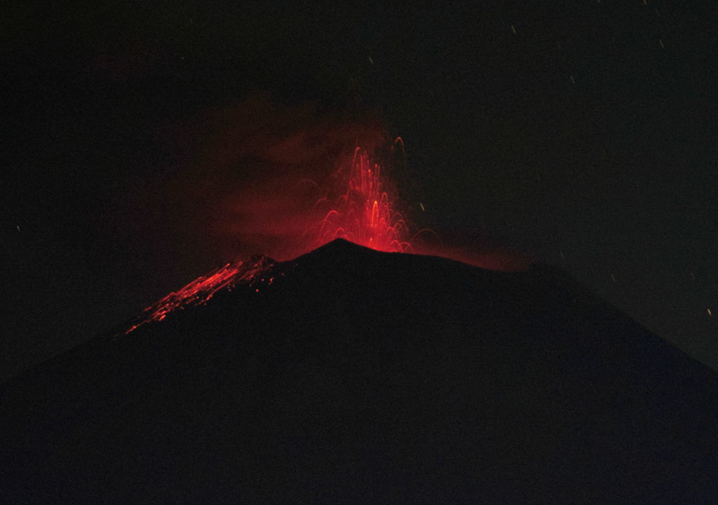 Popocatépetl volcano spewed incandescent materials, ash and smoke seen from the community of Santiago Xalitzintla, Puebla state, Mexico on May 25, 2023. (Credit: CLAUDIO CRUZ/AFP via Getty Images)
