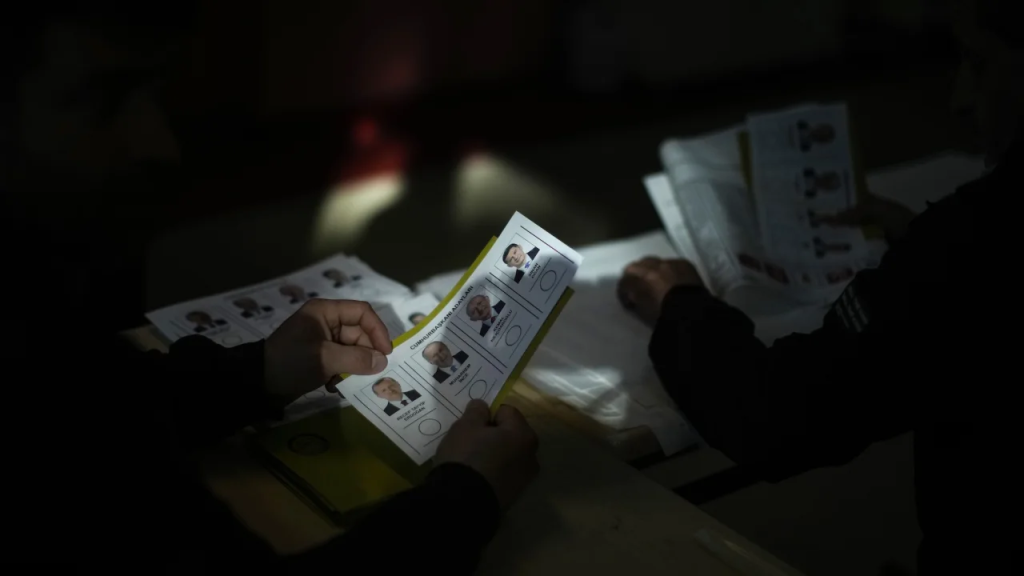 An election representative prepares ballot papers at a polling station in Istanbul.  (Photo: Francisco Sego/AP)