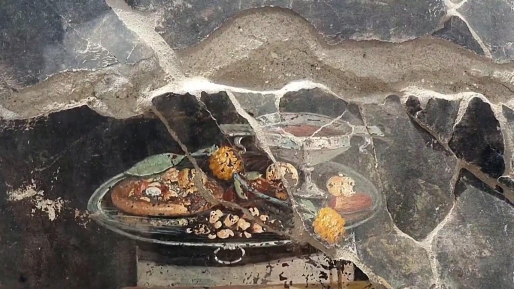 Descubren una especie de "pizza" en un mural de las ruinas de Pompeya