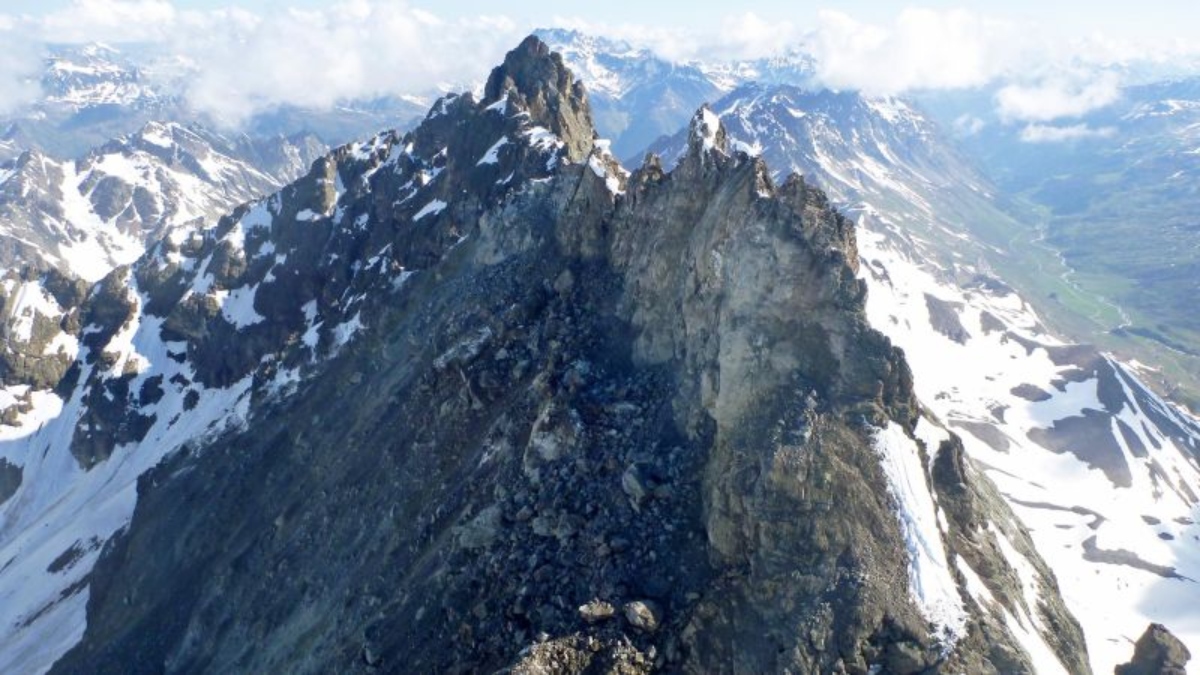 A mountain peak collapses in Austria, causing huge rocks to fall