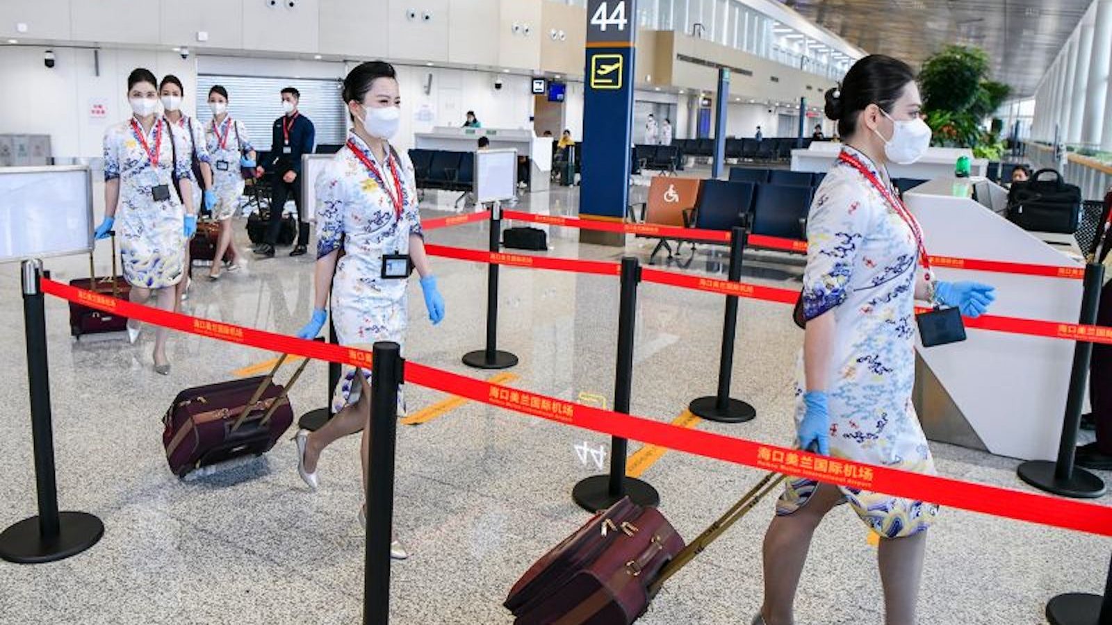 Hainan Airlines flight attendants prepare to board a flight at Haikou Meilan International Airport in Haikou, China, March 17.