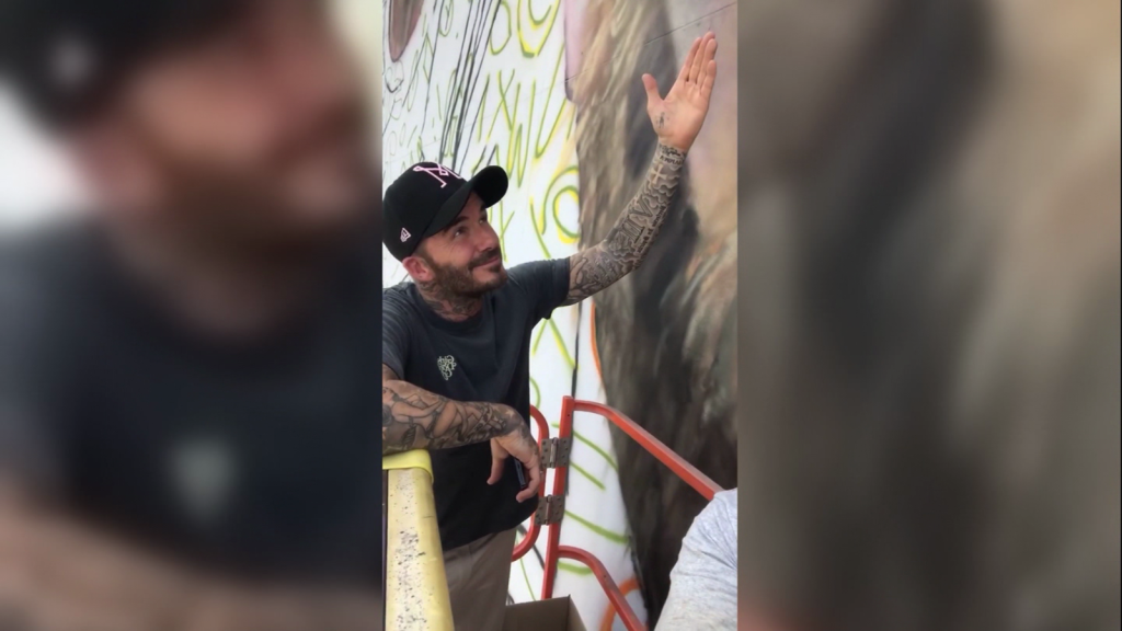Beckham posed next to the Lionel Messi mural in Miami