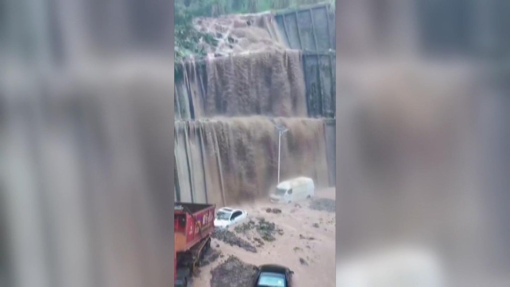 Waterfall forms on Chinese streets after heavy storms