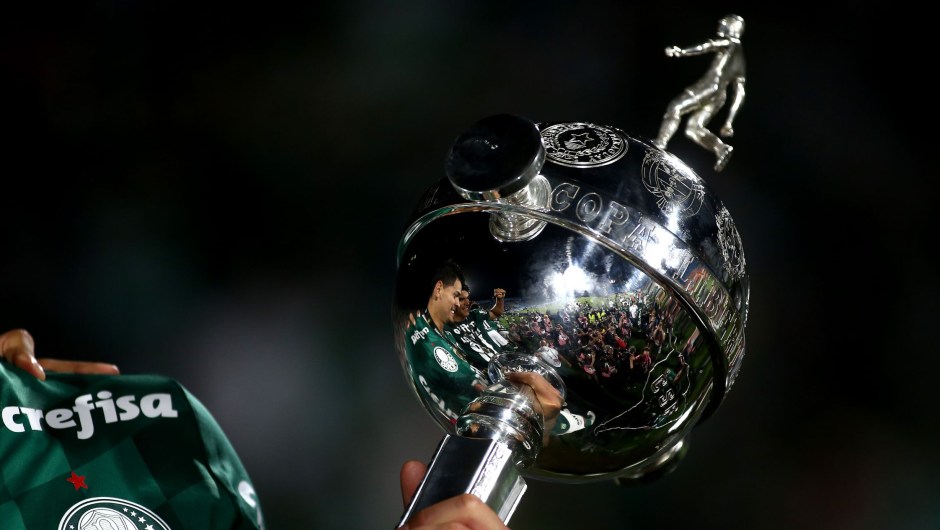 Image of the Copa Libertadores trophy as Palmeiras players celebrate after the 2021 Copa Libertadores final match between Palmeiras and Flamengo.  (Photo: Ernesto Ryan/Getty Images)