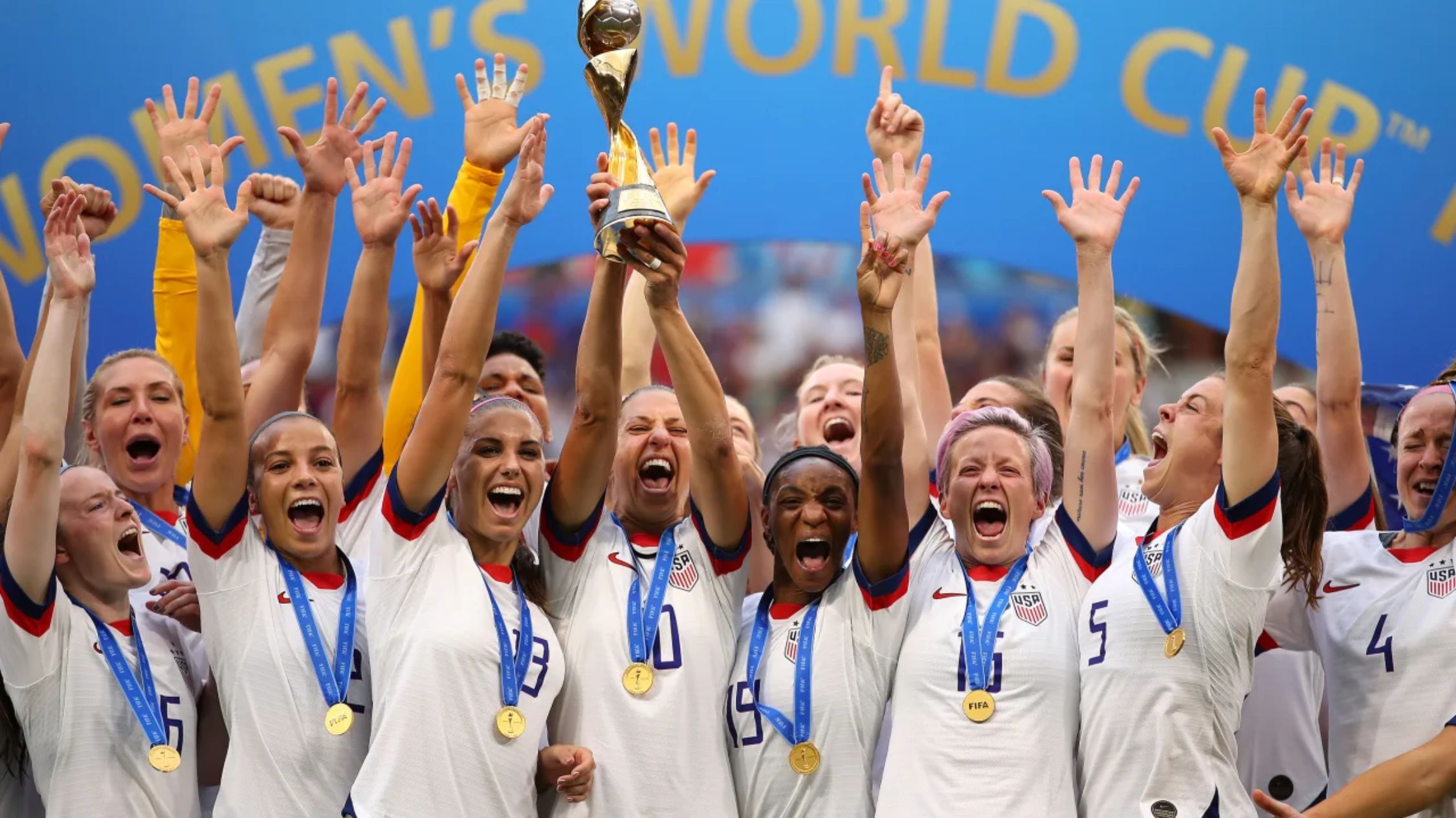 USWNT players celebrate defending their 2019 world title. (Photo: Richard Heathcote/Getty Images)