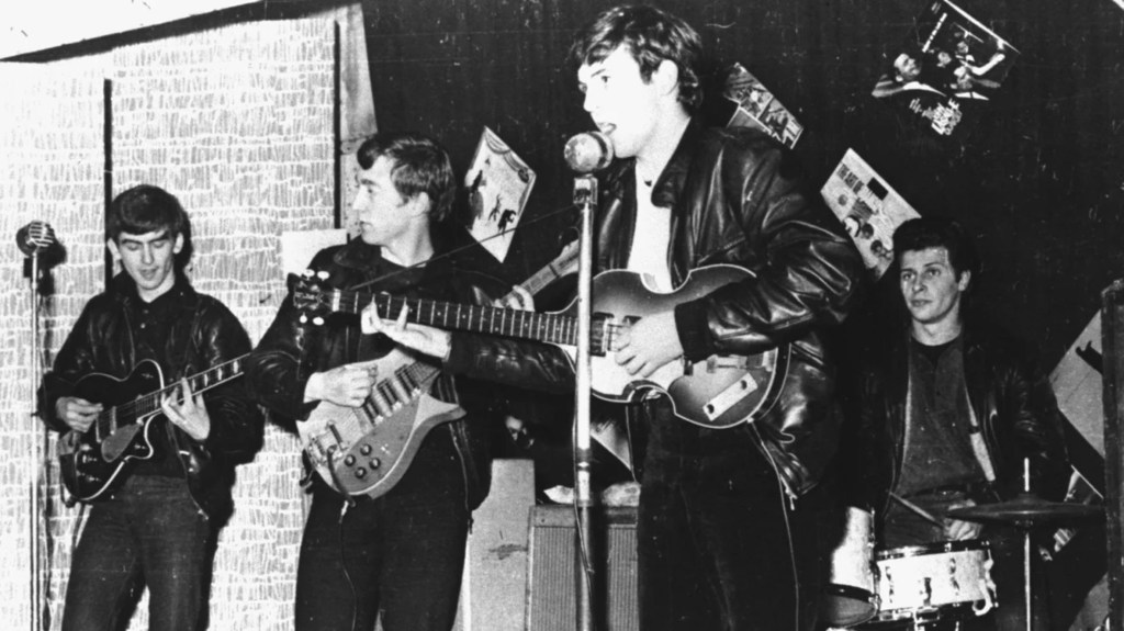 British rock band The Beatles perform at a club before signing their first recording contract, in Liverpool, England, in 1962. (Photo: Hulton Archives/Getty Images)