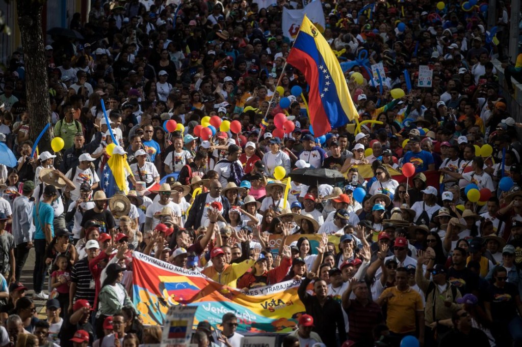 Venezuelans take part in a rally at the end of the campaign for the Essequibo referendum on December 1.  (Credit: Miguel Gutiérrez/EPA-EFE/Shutterstock)