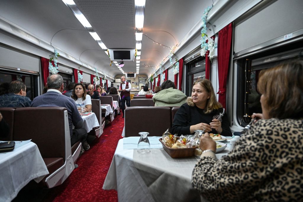 Passengers in the dining room of the Doğu Express train running through eastern Türkiye.  (Photo credit: Ozan Kosi/AFP via Getty Images)