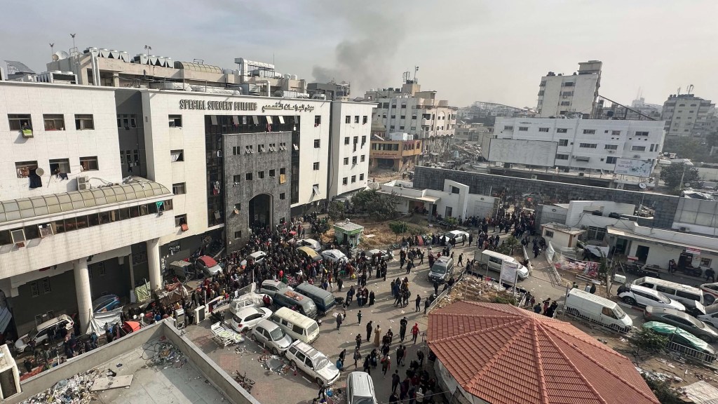 Displaced Palestinians gather in the courtyard of Al-Shifa Hospital in Gaza on December 10.  (Photo: AFP/Getty Images)