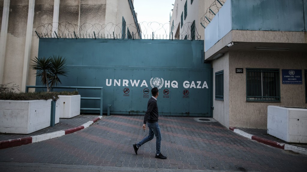 A man walks in front of the United Nations Relief and Works Agency for Palestine Refugees building in Gaza City in January 2023. (Photo: Ali Jadallah/Anadolu Agency via Getty Images)