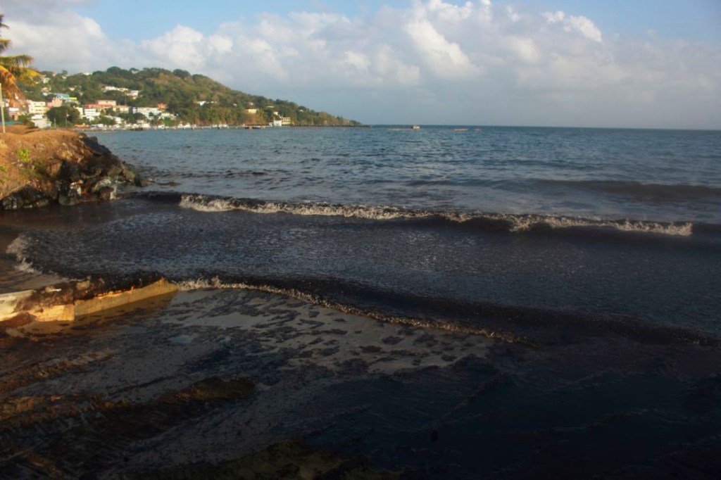 The oil spill, photographed on February 10, has covered about 15 kilometers of coastline in a black residue.  (Credit: Clement Williams/AFP/Getty Images)