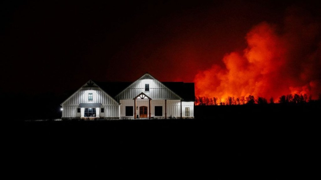 On February 27, 2024, a forest fire broke out behind a house outside of Shattuck, Oklahoma.  (Credit: Nick Oxford/Reuters)