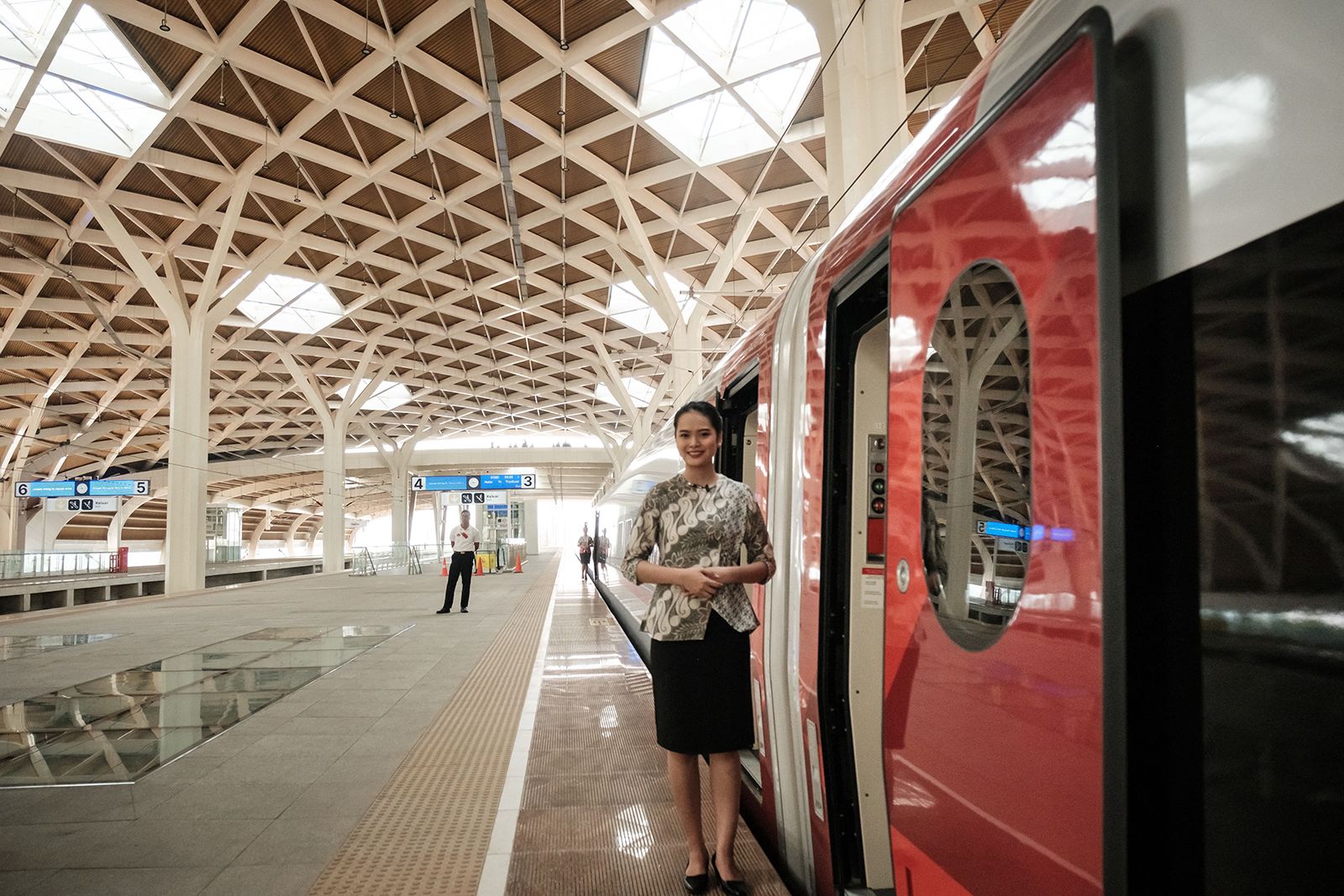 A worker waits for passengers to board the Jakarta-Bandung high-speed train during a one-week public trial at Halim station in Jakarta on September 17, 2023.  (Credit: Yasuyoshi Chiba/AFP/Getty Images)