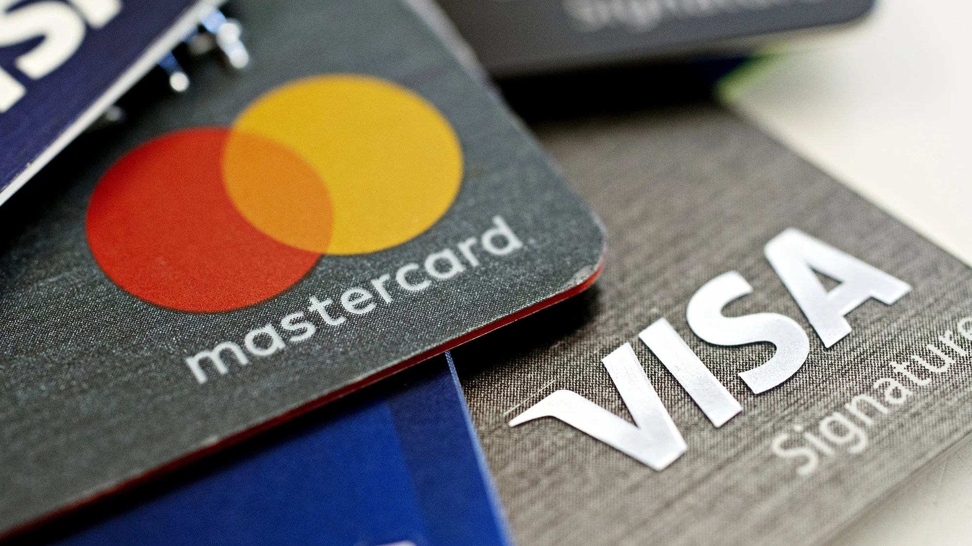 Visa and Mastercard have reached a $30 billion deal that will reduce merchant fees
