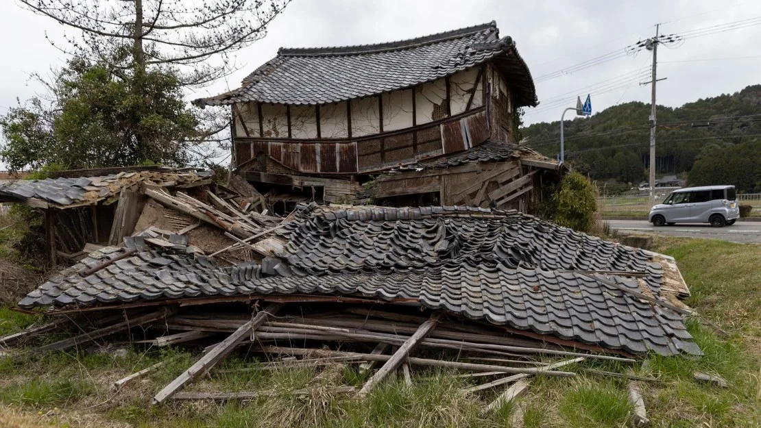 A partially collapsed abandoned wooden house in Thampasayama, Japan on April 5, 2023, Budhika Weerasinghe/Getty Images