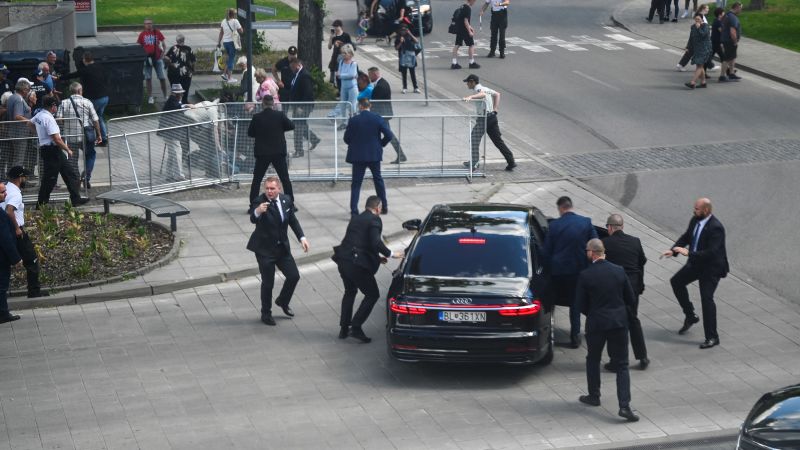 Security officers carry Slovak Prime Minister Robert Fico into a car after the shooting in Handlova on May 15, 2024. (Credit: Radovan Stoklasa/Reuters)