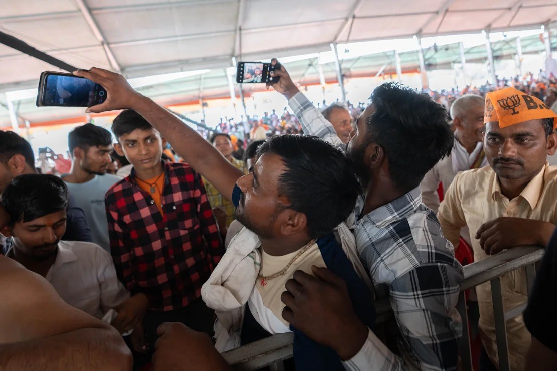 Modi supporters take a selfie in Aligarh, India on April 22, 2024.  (Photo: John Meese/CNN)