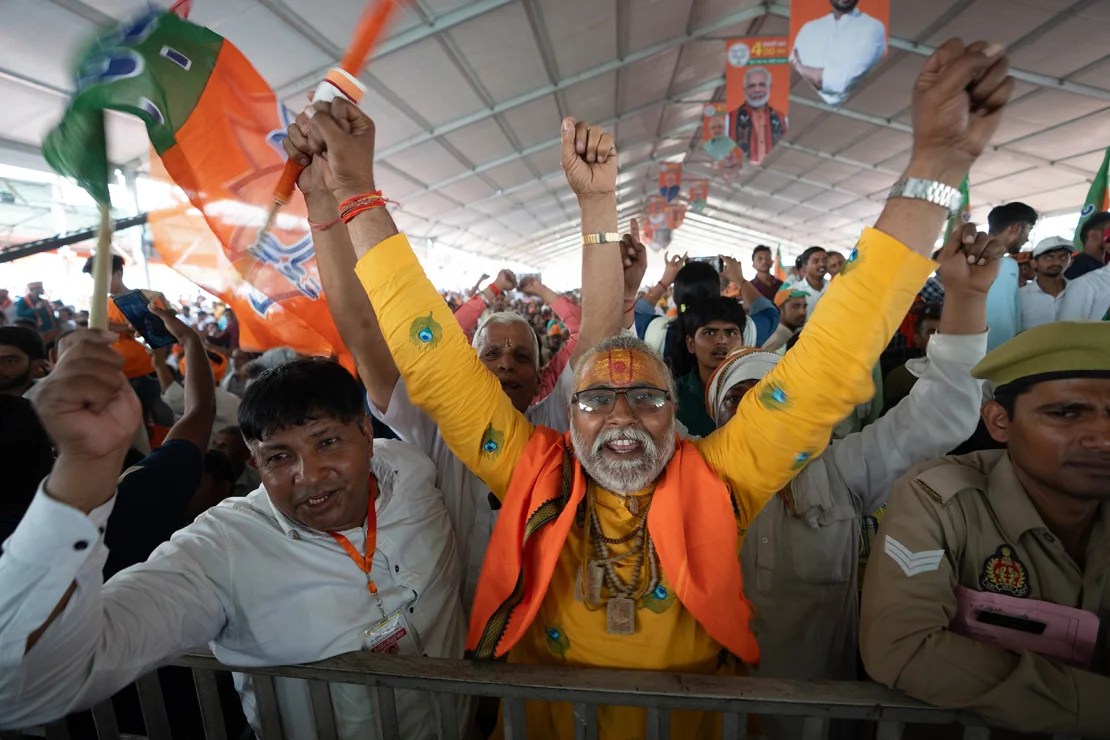 Supporters wave the BJP flag of Prime Minister Narendra Modi in Aligarh, India on April 22, 2024.  (Photo: John Meese/CNN)